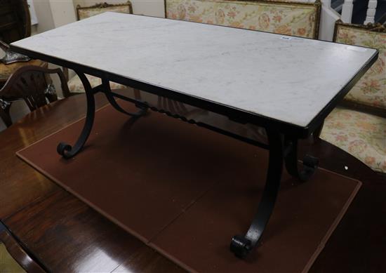 A wrought iron marble topped coffee table W.113cm